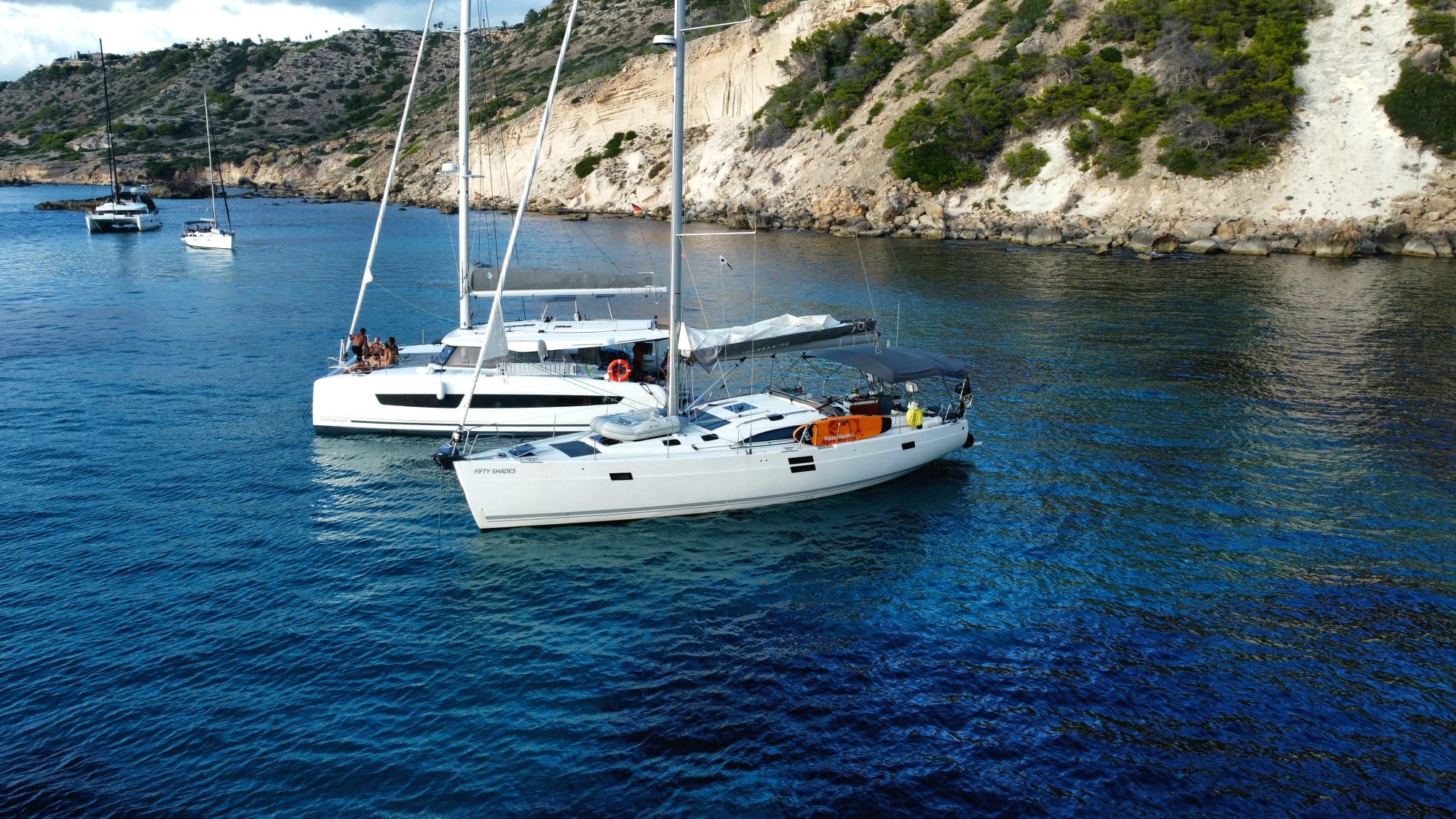 Fifty Shades sailing yacht anchored in a sheltered Mallorcan cove